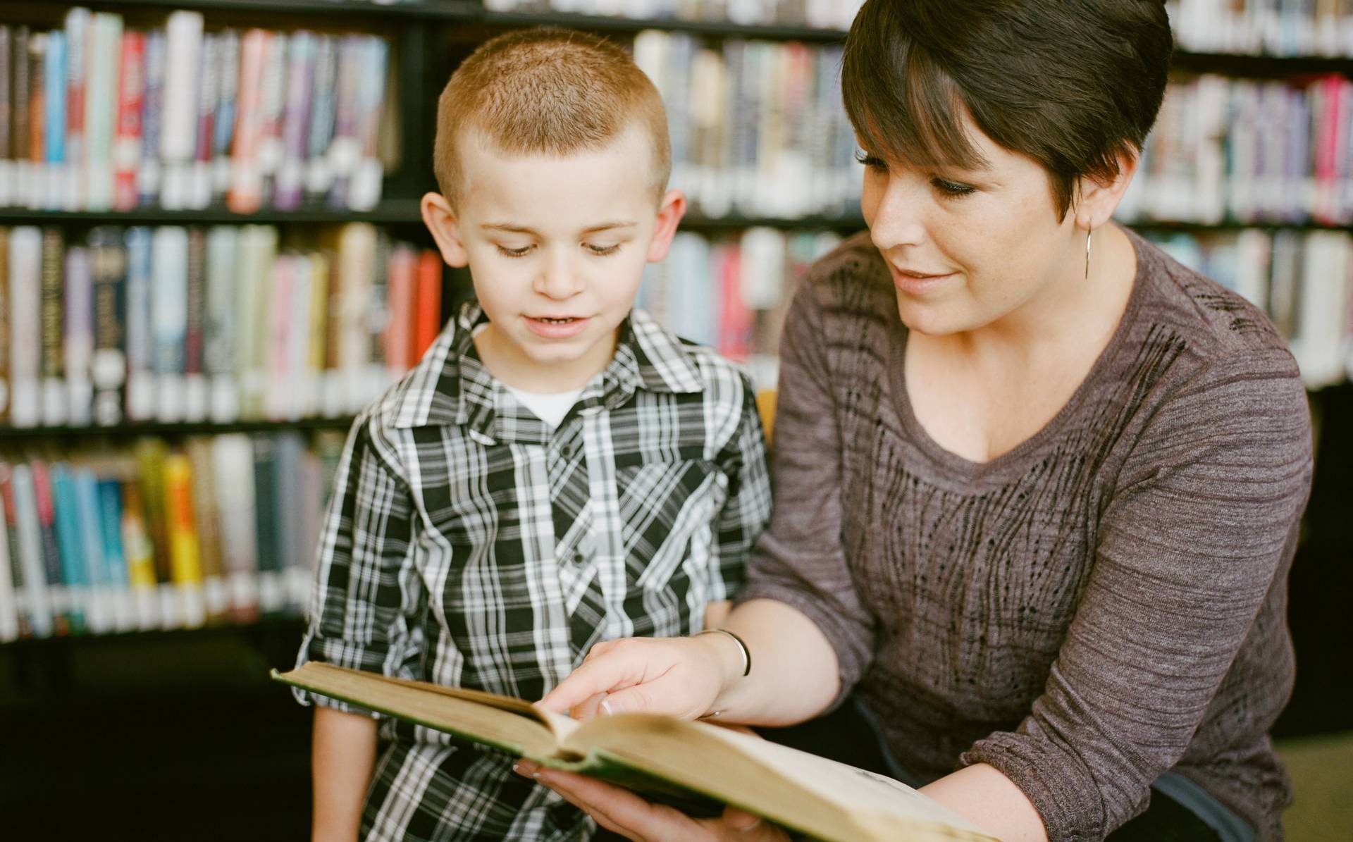 woman with a child reading