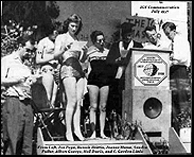 The University celebrated the International Geophysical Year commemoration in July 1957 at the Geophysical Institute. From left, Joe Pope, Bonnie Brittin, Jeanne Hume, Sandra Fuller, Albert George, Neil Davis, and C. Gordon Little