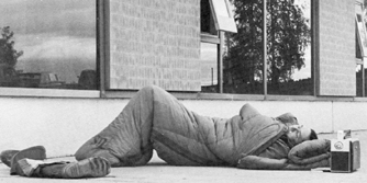 Sleep was often a rare experience during the refugee influx. Here, an evacuee sleeps outside the Commons.