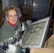 Pauline Shrrock of Anchorage helps to sort through a storage container in search of UA's first diploma. Photo: Kate Wattum, 2004