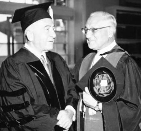 Sen. Ernest Gruening here is shown chatting with Dr. Abraham L. Sachar, Pres. of Brandeis Univ., on the occasion of the presentation of an honorary degree to Senator Gruening. Source: Rasmuson Library, UAF