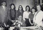 Keith Mather, seated, is surrounded by staff in the vice chancellor's office in 1983. From left, Bob Sackett, Marsha Wendt, Dorothy Yates, Alexandra Driussi, Valerie Belon and Anna Shilling.