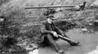 Photograph of Luther Hess as he pans for gold. Photo from Rasmuson Library, Charles E. Bunnell Collection