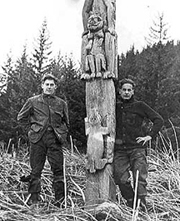 Waino Hendrickson and L.J. MacKinnon pose with a totem in Auke Bay. Photo: Juneau Empite