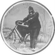 Phil Ernst in the snow with a bike.