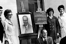 At the 1975 building dedication, O'Neill's family poses with his photograph. Pictured are his son, William; widow, Vi; brother Patrick; and daughters Sally Wien and Maureen O'Neill.