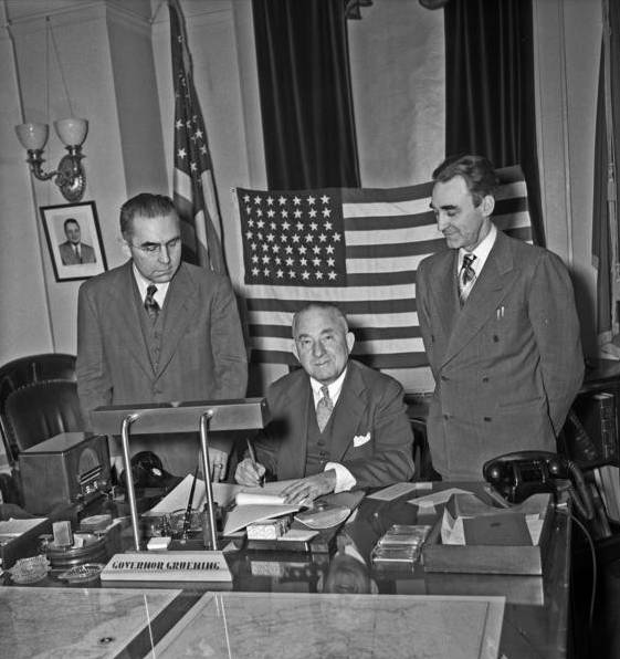 Nolan, Peratrovich & Gov. Gruening signing Alaska Income Tax Bill, 1949. Photo: Steve McCutcheon, McCutcheon Collection, Anchorage Musuem, B1990. 14.5.Pol. 13.27